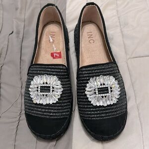 Black heavyweight canvas decorated black shoe with diamond emblems .